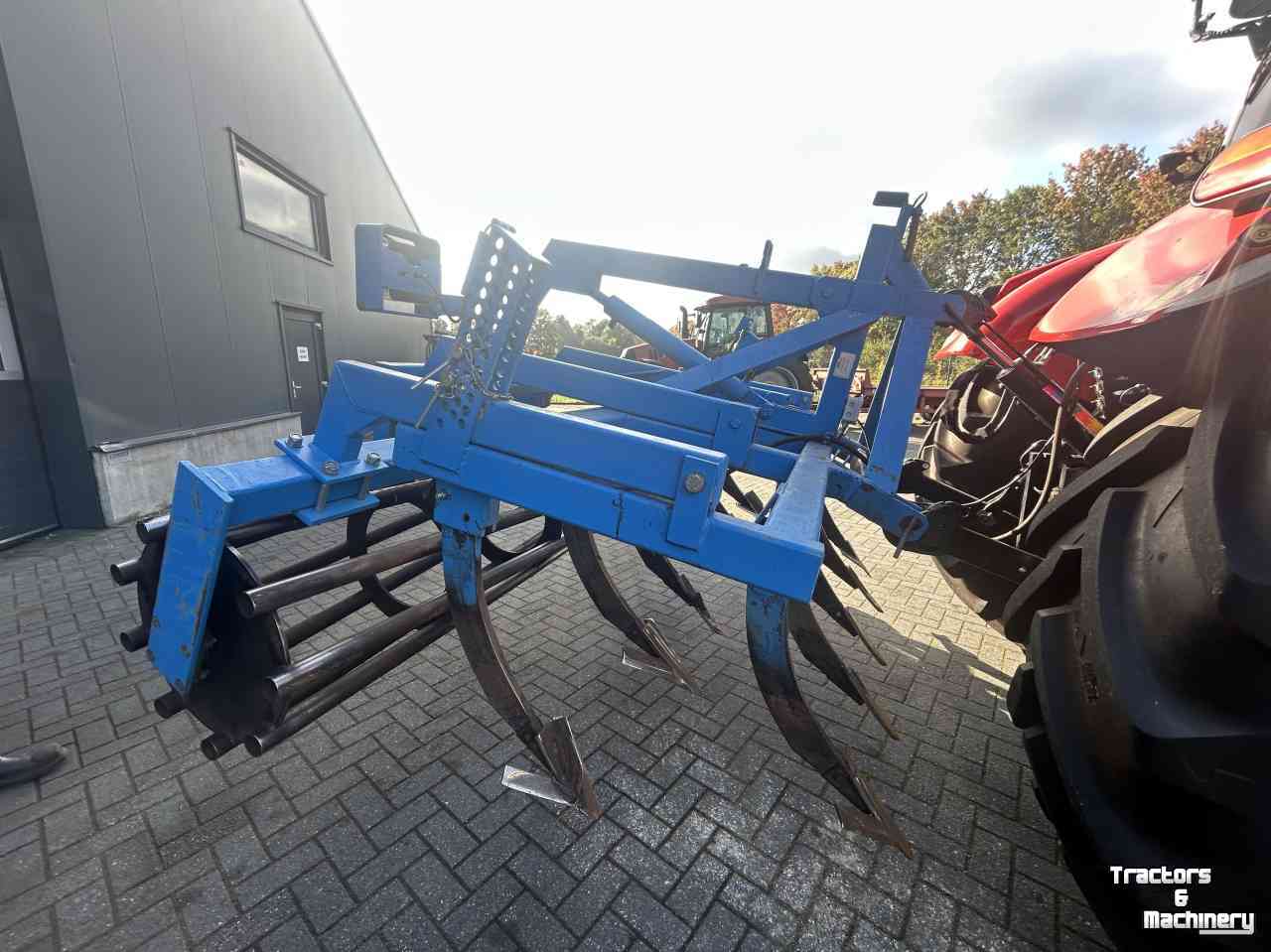 Cultivateur  Vaste tand cultivator met kooirol en hefinrichting