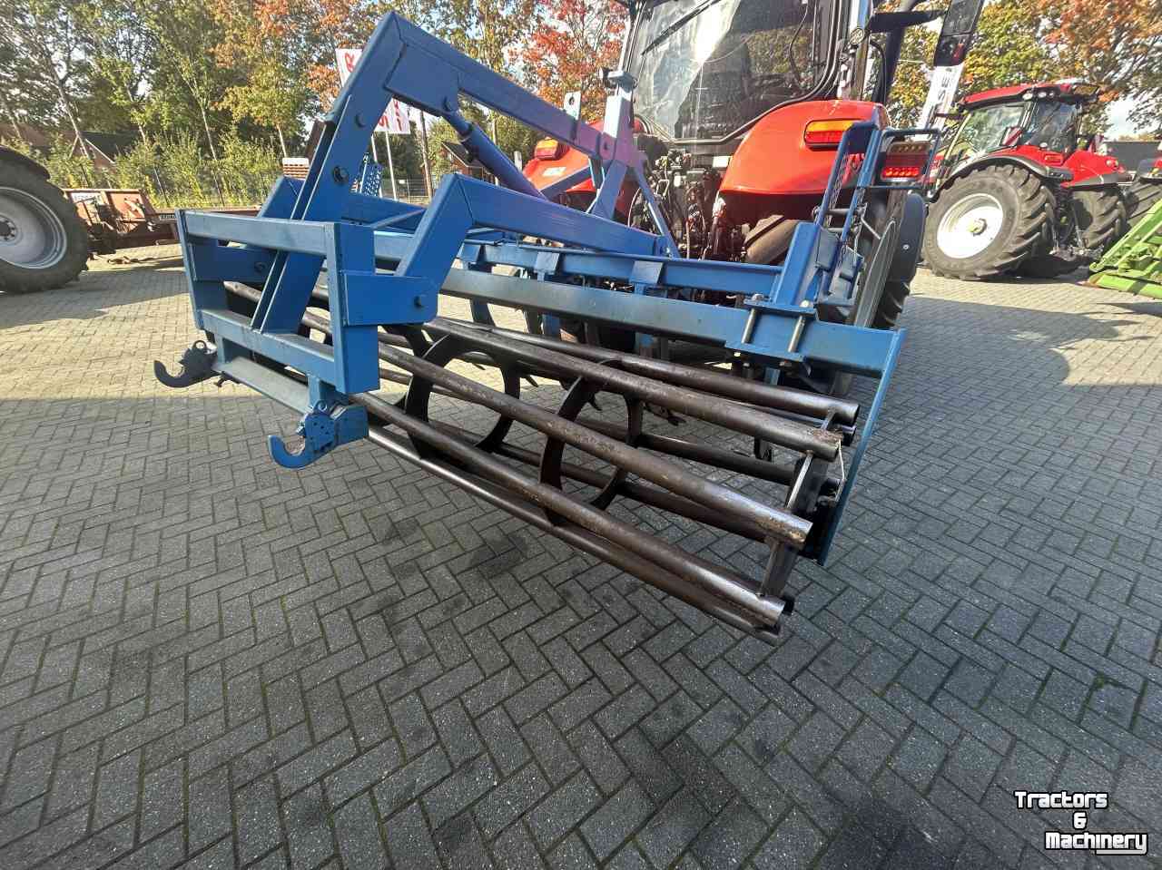 Cultivateur  Vaste tand cultivator met kooirol en hefinrichting