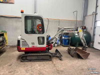 Pelles sur chenilles Takeuchi TB016 met machinetrailer