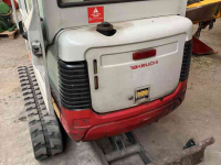 Pelles sur chenilles Takeuchi TB016 met machinetrailer