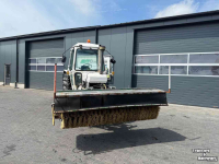 Tracteur Ford 6610 met rolbezem