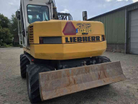 Pelles sur pneus Liebherr 312 banden kraan graafmachine