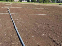 Tuyaux d‘irrigation  Beregeningsinstallatie / Beregeningsset met beregeningsbuizen, haspel en beregeningspomp