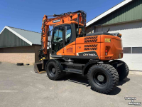 Pelles sur pneus Doosan DX140w-5 met draaikantelstuk