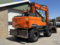 Pelles sur pneus Doosan DX140w-5 met draaikantelstuk