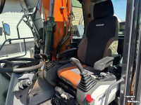 Pelles sur pneus Doosan DX140w-5 met draaikantelstuk